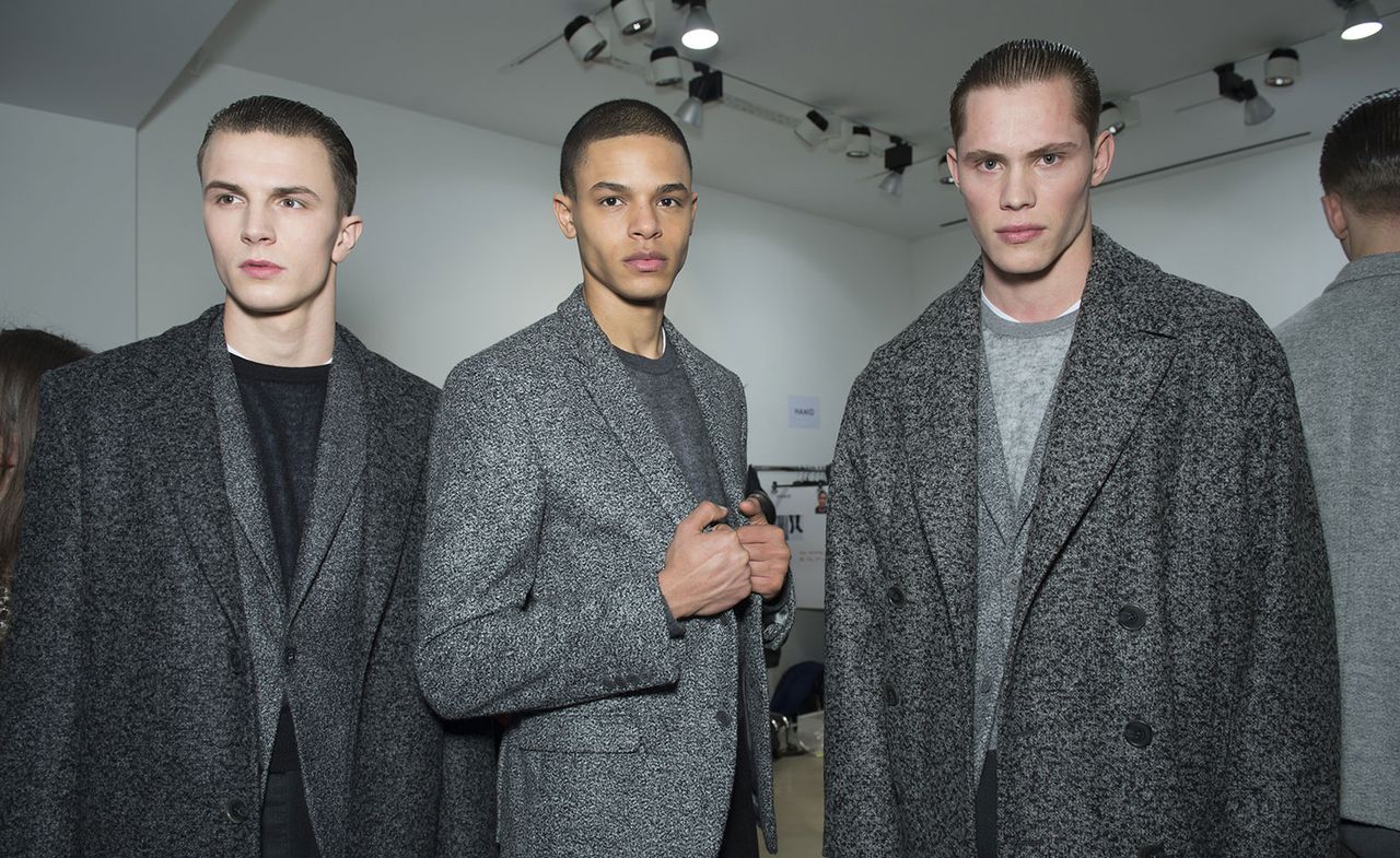 Male models wearing stylish gray wool coats from A/W 2015 Calvin Klein Collection.