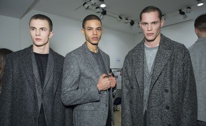 Male models wearing stylish wool coats from A/W 2015 Calvin Klein Collection.