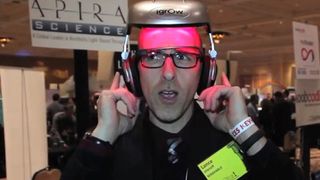 A reporter from Mashable demonstrates iGrow, a helmet retrofitted with dozens of lasers and LED lights that are thought to help stimulate hair growth.