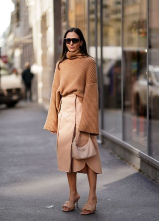 A chic woman wearing an all-camel look