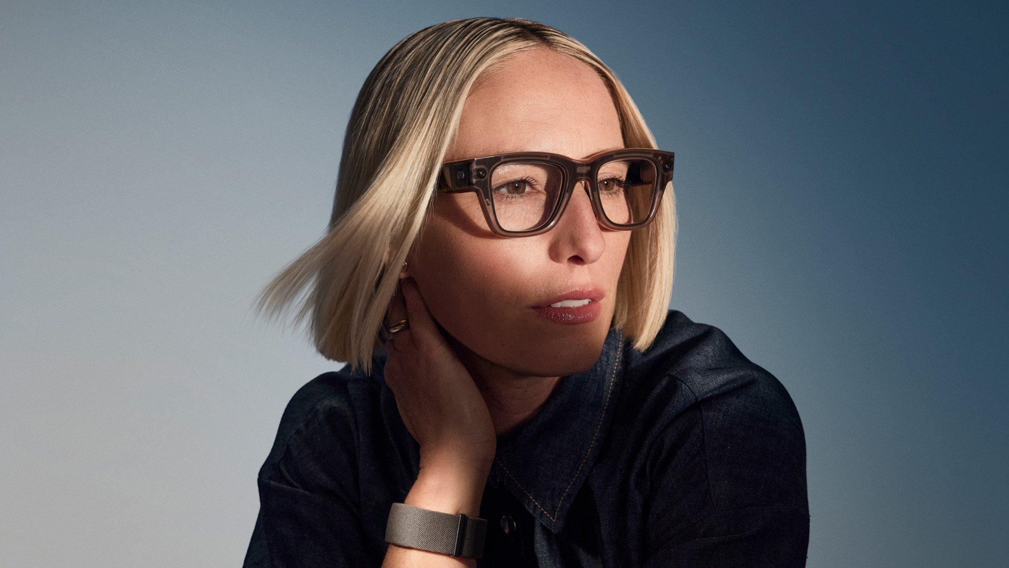 An official lifestyle shot of someone wearing Meta Ray-Ban Display Glasses
