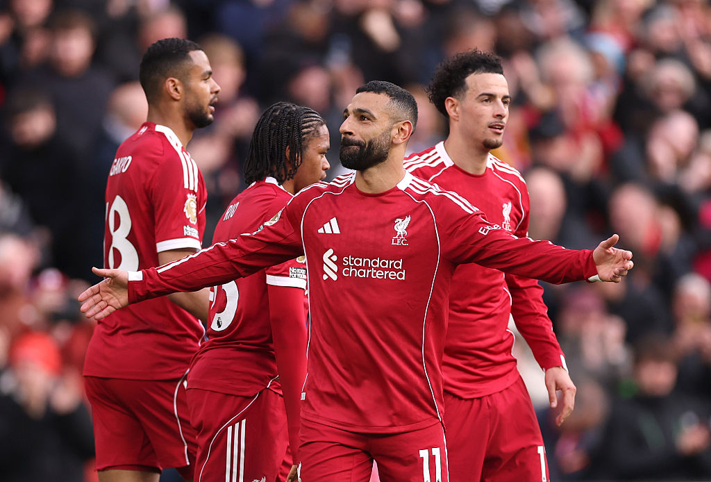 Mohamed Salah of Liverpool celebrates scoring his team's second goal with teammates during the Premier League match between Liverpool and Fulham