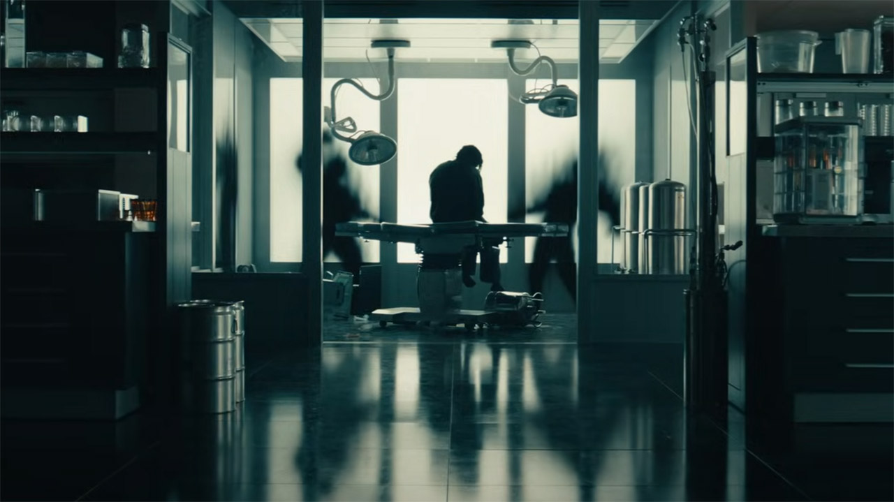 Bob Reynolds sitting on a medical bed next to two people turned into shadows in Marvel's Thunderbolts* movie