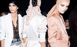 Models wear satin suits and headscarves at Tom Ford S/S 2019