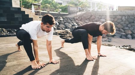 two men doing the lizard lunge 
