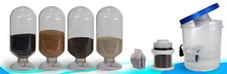 From left to right: Four vials of composite nanomaterials used in the filter, a sachet containing the materials, a filter cartridge, and a prototype of the water filtration device.