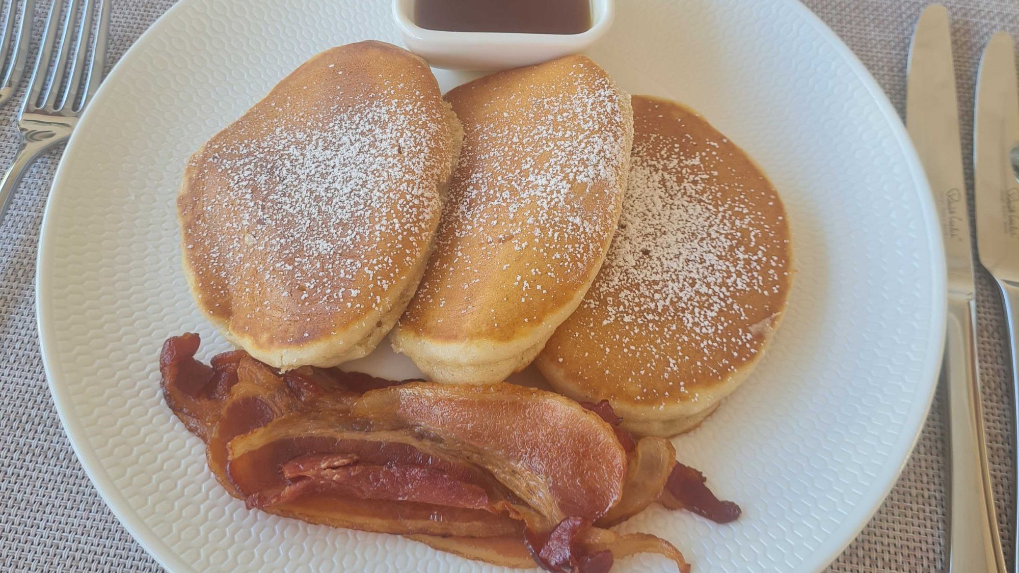 Pancakes, bacon and syrup at Rock Villa