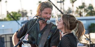 Bradley Cooper and Lady Gaga on stage singing in A Star is Born