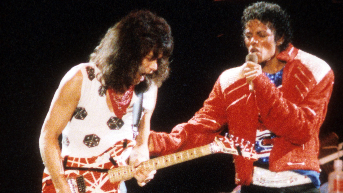 DALLAS - JULY 1984:  Guitarist Eddie Van Halen joins pop star Michael Jackson on stage to perform his hit song "Beat It" during The Jacksons Victory Tour on July 14, 1984 at Texas Stadium in Dallas, Texas. (Photo by Michael Ochs Archives/Getty Images)