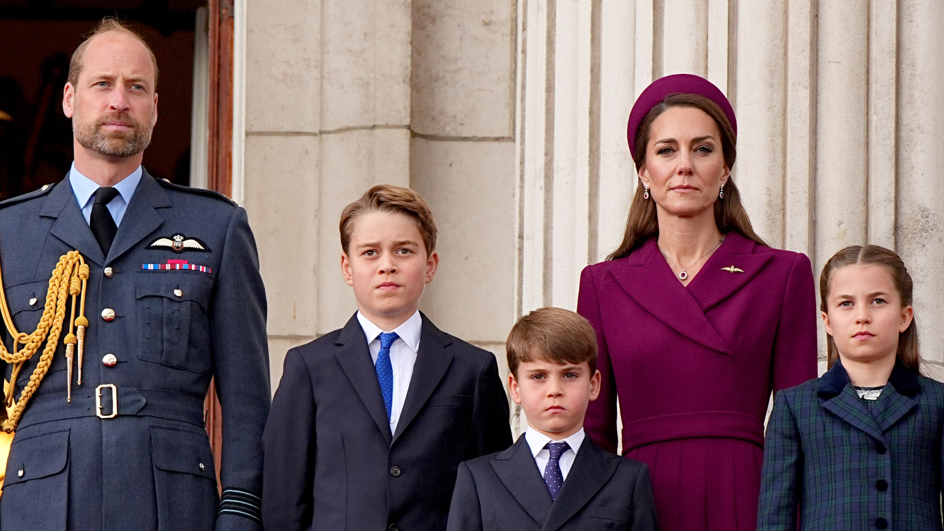 Prince William stands on the Buckingham Palace balcony with children Prince George, Princess Charlotte, and Prince Louis, and wife Kate Middleton