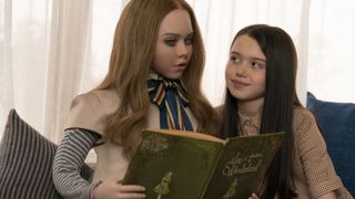 Amie Donald as M3GAN and Violet McGraw as Cady in M3GAN