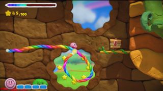 Kirby riding a rope during Kirby and the Rainbow Paintbrush.