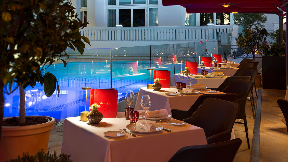 Outdoor tables by the pool at Fouquet's, Cannes