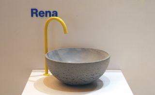 Lowinfo exhibited an impressive array of smooth concrete washbasins with bright yellow taps in 100% Design's kitchen and bathroom section