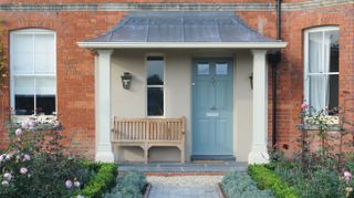 blue front door on period home