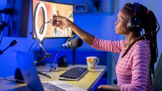 A YouTuber uses one of the best ring lights in a home studio