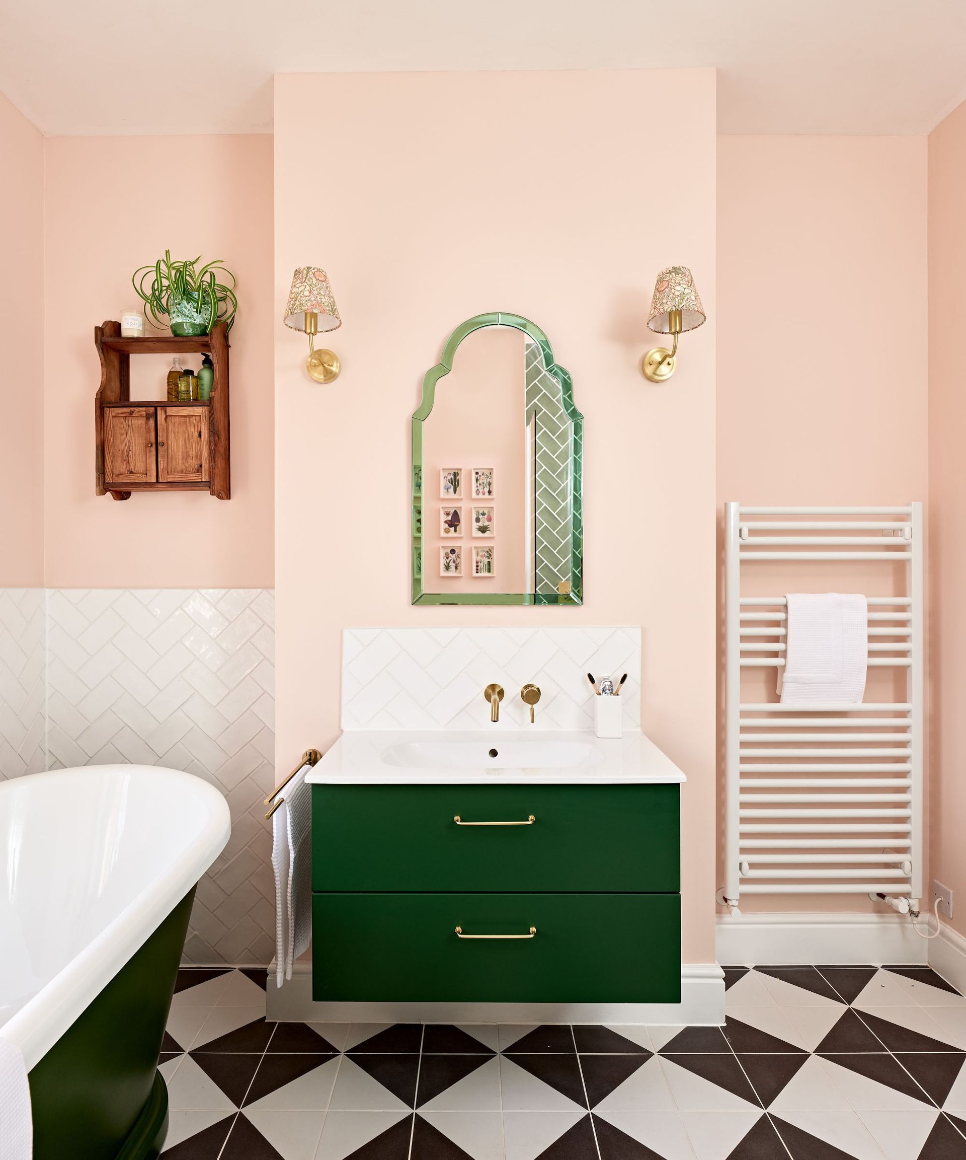 pink and black bathroom with checkerboard floor tiles