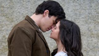 Lachlan Quarmby and Katie Stevens lean in to kiss in the Hallmark trilogy Providence Falls.