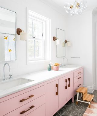 Pink cabinets and drawers, twin sinks