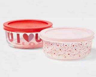 Two glass food storage containers with heart motifs