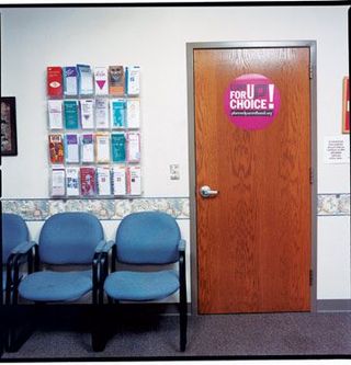 a door at a clinic next to brochures