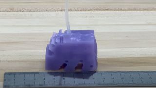 A small purple walking robot created by Northwestern University