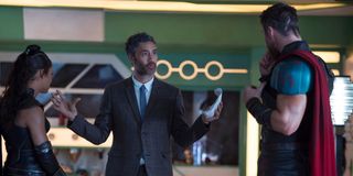 Taika Waititi talking to Tessa Thompson and Chris Hemsworth on the set of Thor: Ragnarok