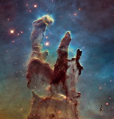 iconic pillars of creation , with tall elephant trunks in the eagle nebula