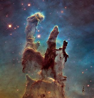 iconic pillars of creation , with tall elephant trunks in the eagle nebula
