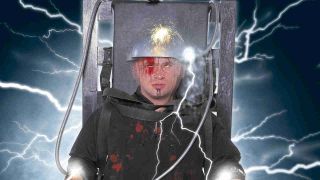 Disturbed’s David Draiman sitting in an electric chair in 2001