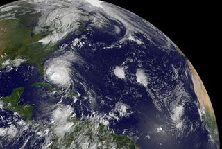The GOES-13 satellite saw Hurricane Irene moving through the Bahamas on August 25, 2011 at 1402 UTC (10:02 a.m. EDT) and far to the east was newly born Tropical Depression 10 (far left). Irene dwarfs Tropical Depression 10, and Irene is about 1/3rd the size of the entire U.S. East coast.