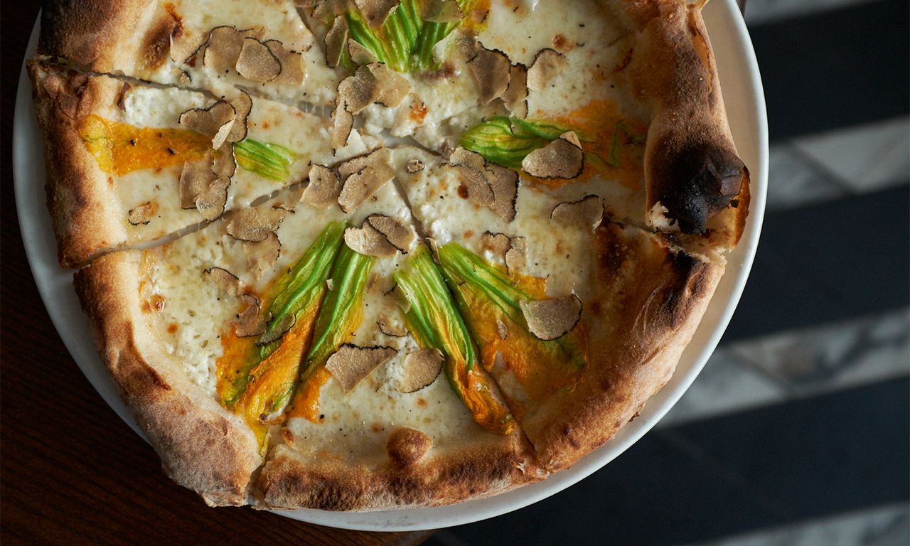 White sauce pizza with mushroom &amp; green leaves