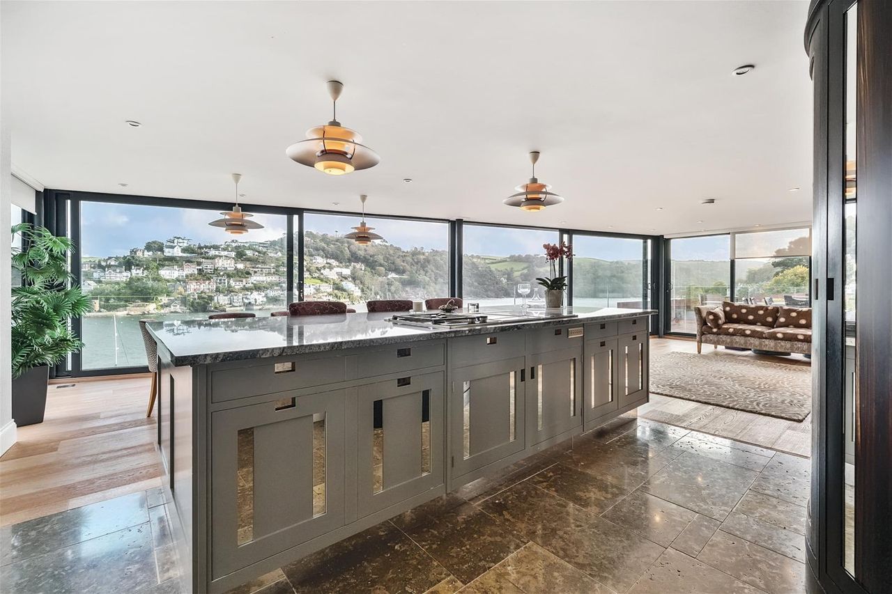A modern kitchen with sea views.