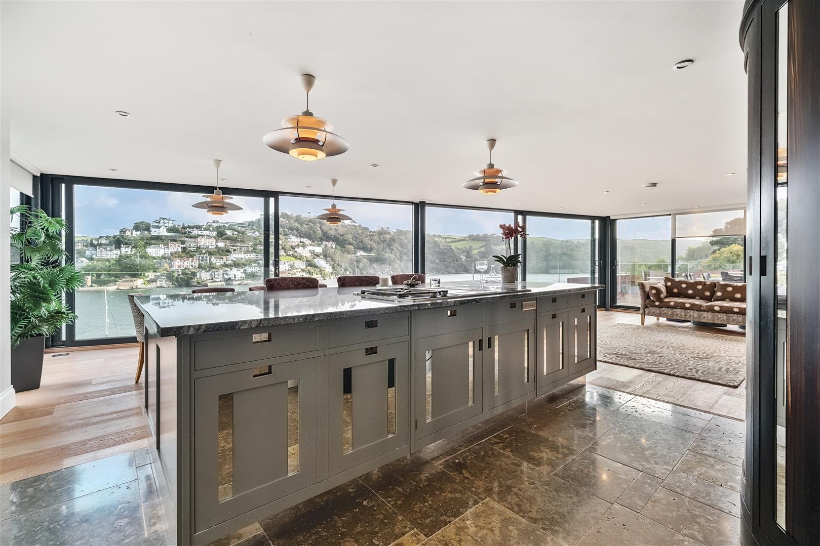 A modern kitchen with sea views.