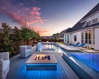 backyard pool and fire pit by Aquaterra Outdoors with lights by Lights by Signature