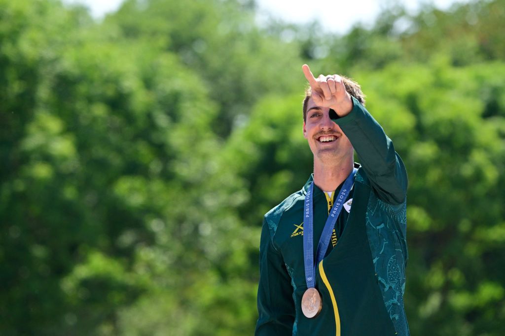 South Africa's Alan Hatherly celebrates his bronze medal on the podium after the men's cross-country mountain biking event during the Paris 2024 Olympic Games in Elancourt Hill venue in Elancourt, on July 29, 2024. (Photo by John MACDOUGALL / AFP)