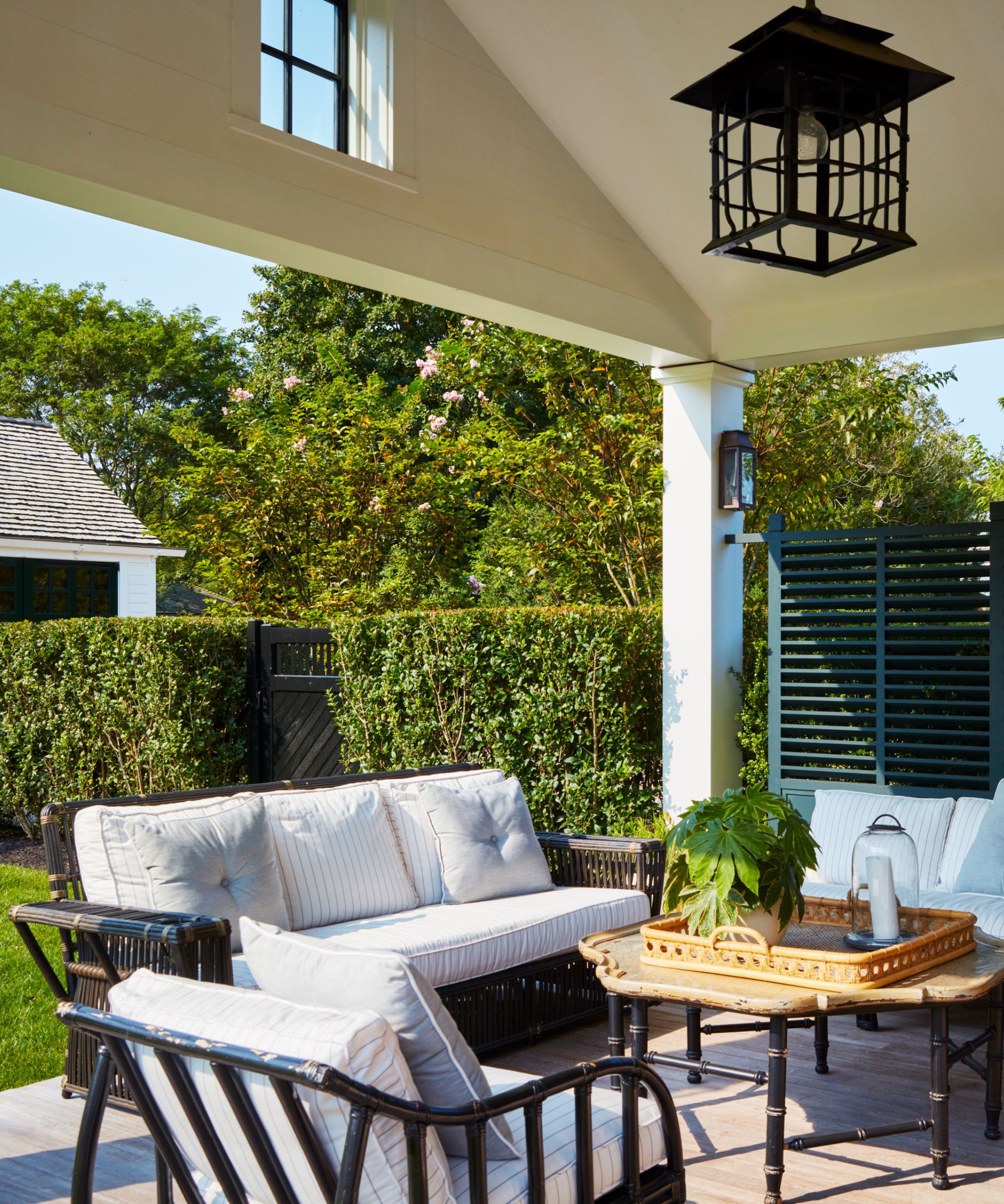 Outdoor veranda with lounge chairs and coffee table