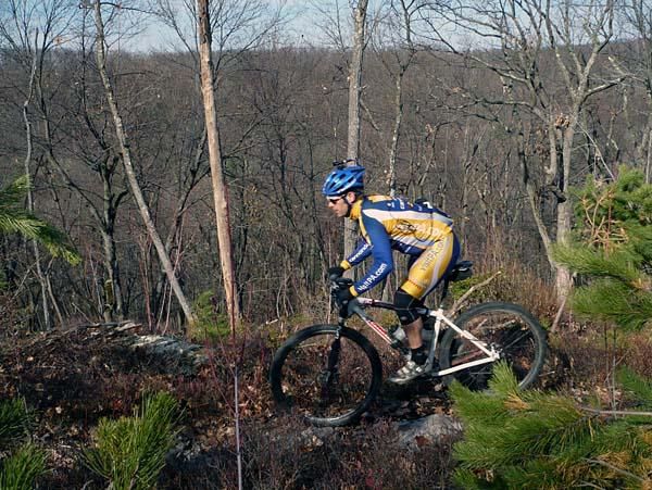 Trans-Sylvania Promoter Mike Kuhn rides a ridge in Bald Eagle State Forest that will be part of the prologue.