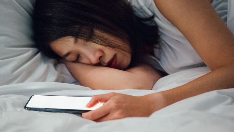 Woman sleeping on her mobile