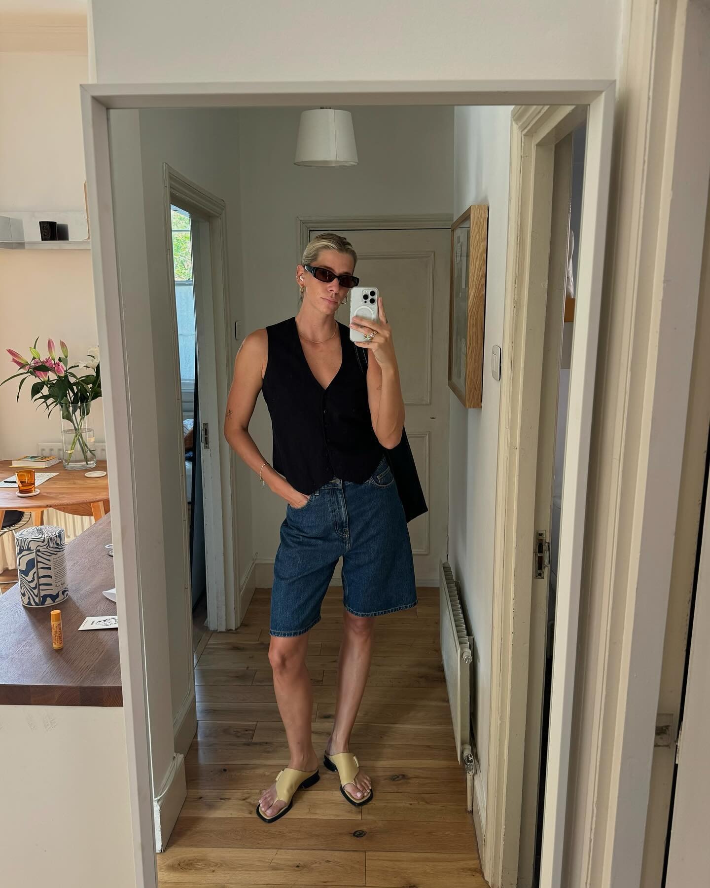 Lindsey Holland wearing blue denim shorts.