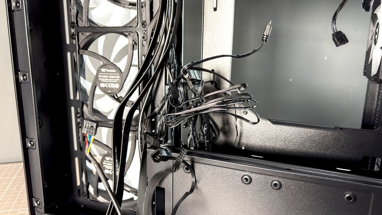 The Thermaltake View 380 WS ARGB on a desk with various components fitted.
