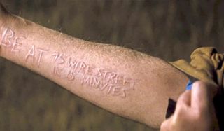 Looper a scarring message on Older Seth's arm