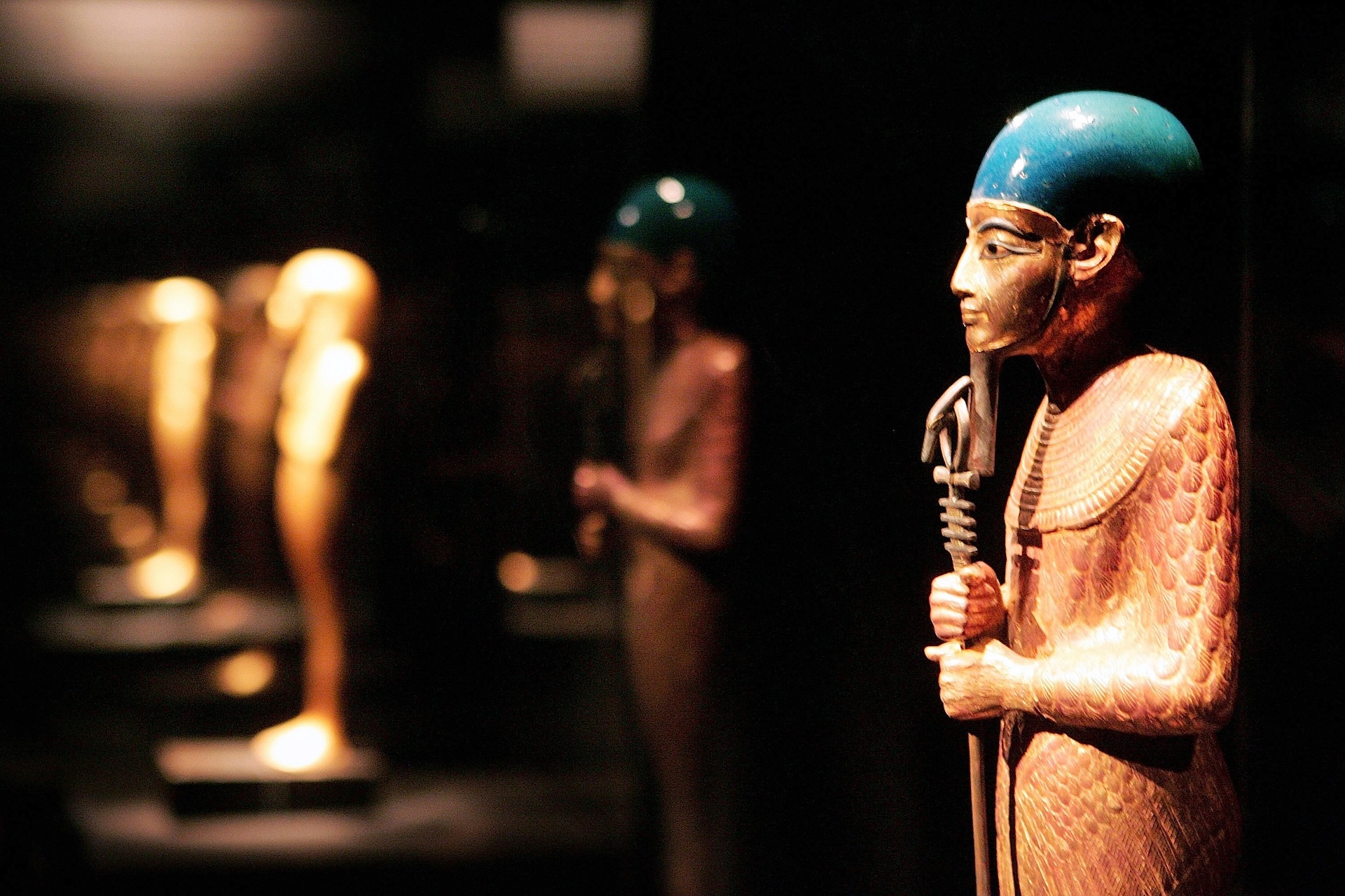 a row of Egyptian statues