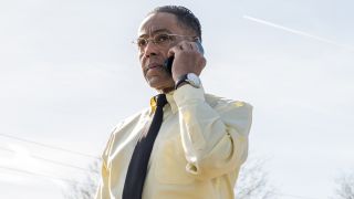 Giancarlo Esposito's Gus Fring answers his mobile phone in an outdoors setting in Breaking Bad