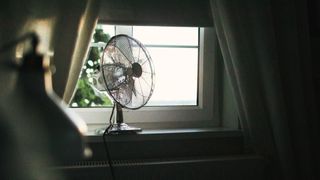 What is the ideal temperature for sleeping - fan placed next to open window for cooling effect