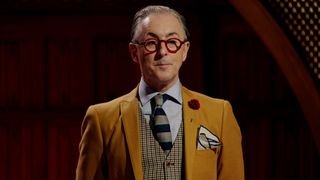 Alan Cumming in a yellow blazer in Peacock's the Traitors