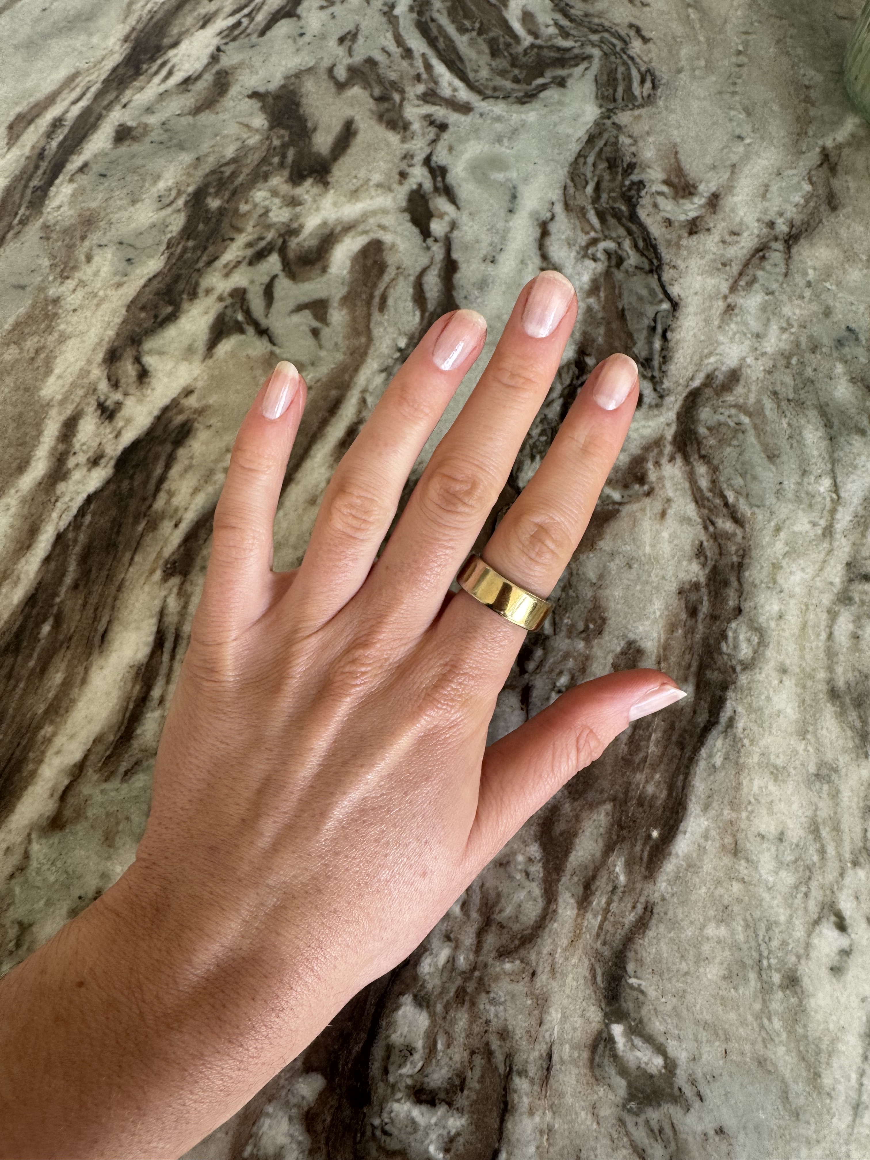 Eleanor's hands with one coat of OPI'm a Bubble Bunny Nail Polish