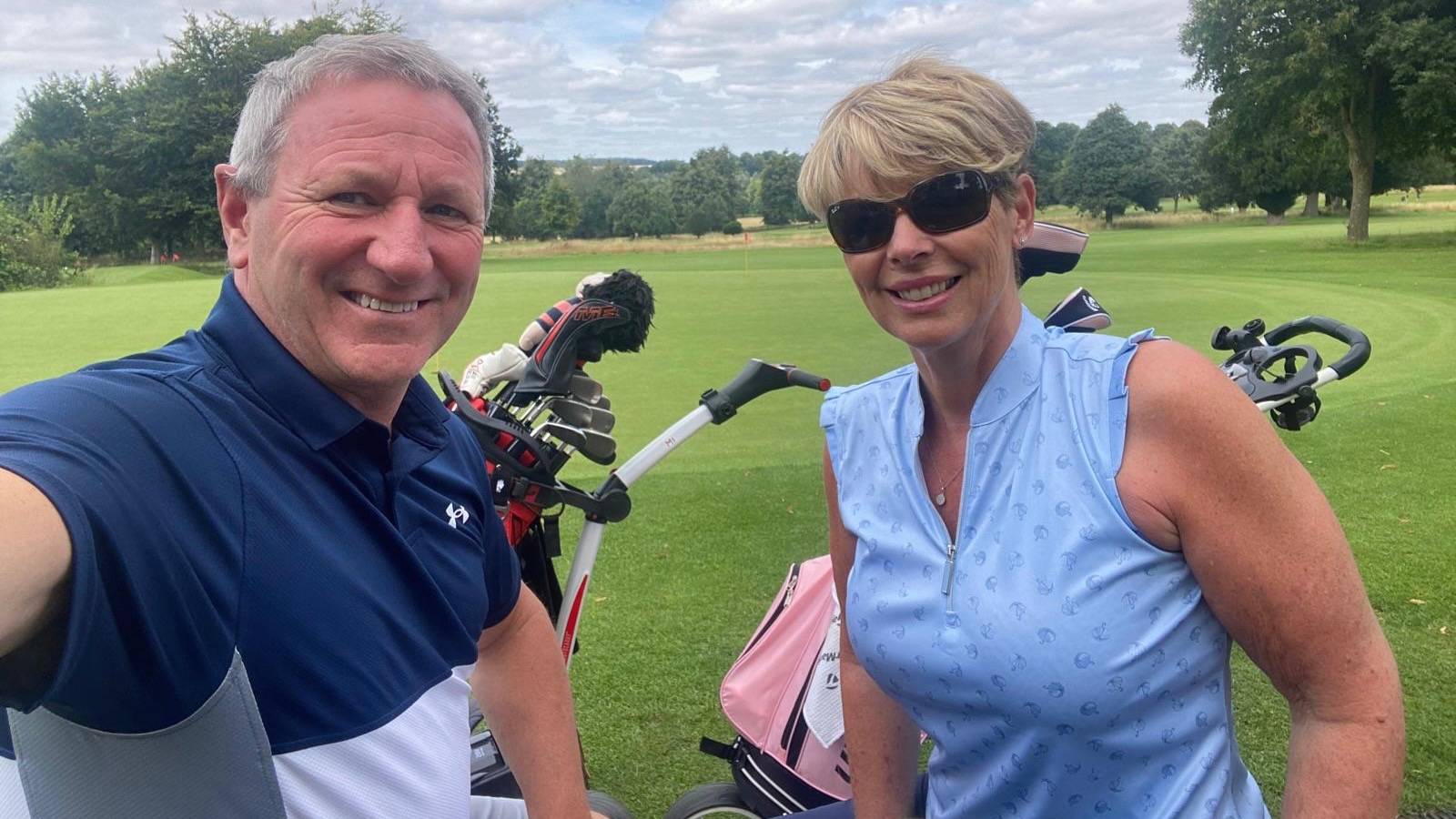 Female and male golfer enjoying a round of golf