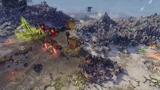 Daemon armies besieging a settlement in Total War: Warhammer 3