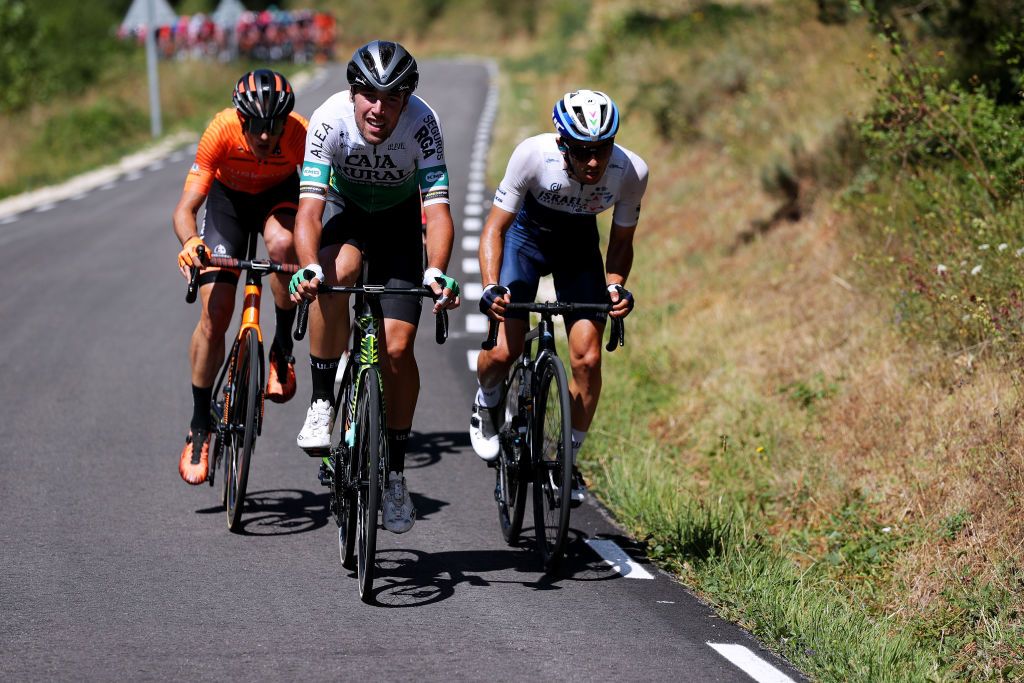 ESPINOSA DE LOS MONTEROS SPAIN AUGUST 05 LR Joan Bou Company of Spain and Team Euskaltel Euskadi Oier Lazkano Lopez of Spain and Team Caja RuralSeguros RGA Guy Niv of Israel and Team Israel StartUp Nation in the Breakaway during the 43rd Vuelta a Burgos 2021 Stage 3 a 173km stage from Busto de Bureba to Espinosa de los Monteros VueltaBurgos BurgosCycling CapitalMundialdelCiclismo on August 05 2021 in Espinosa de Los Monteros Spain Photo by Gonzalo Arroyo MorenoGetty Images